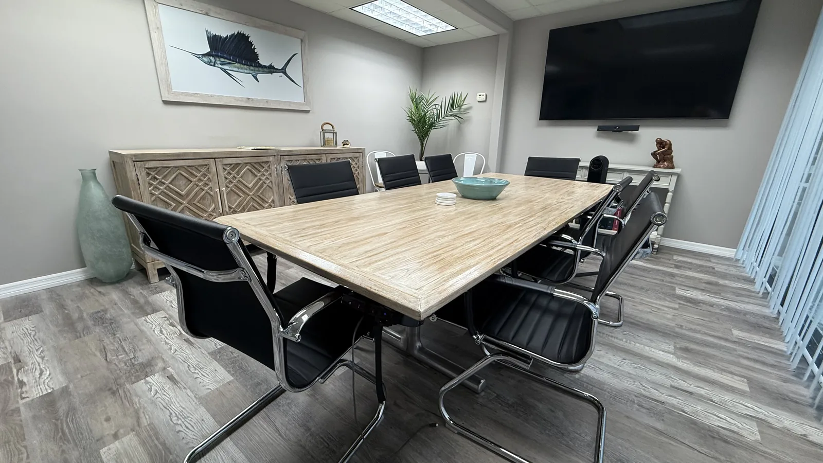 AV-ready conference room with seating for eight at Hibiscus Executive Suites.